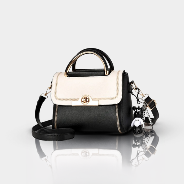 Black and white handbag with bear charms