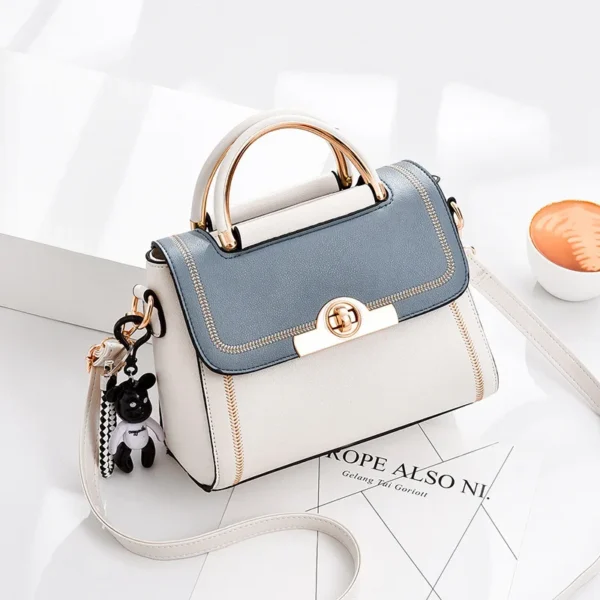 Elegant white and blue handbag with gold accents