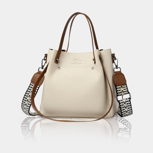 Cream leather handbag with brown handles.