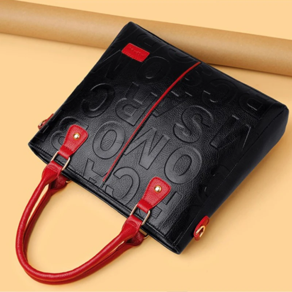 Black leather handbag with red straps