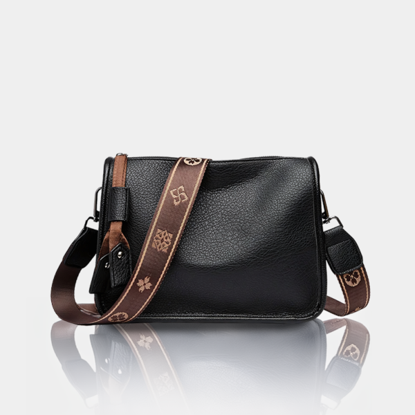 Black leather crossbody bag with brown strap.