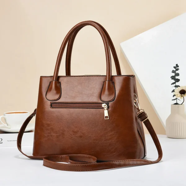 Brown leather handbag with strap