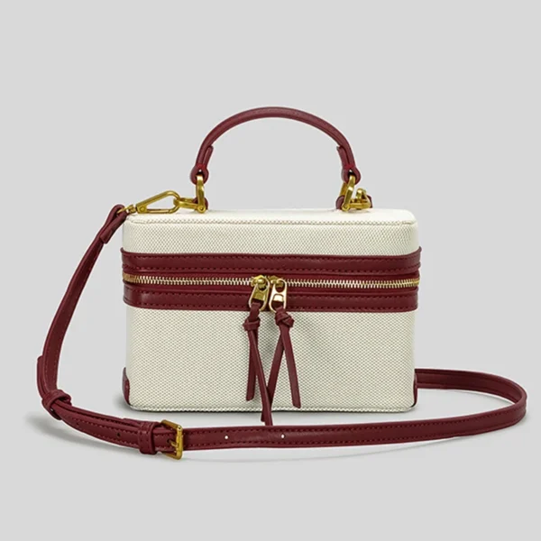 Canvas handbag with maroon leather trim and strap