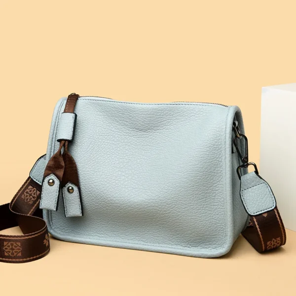 Light blue handbag with brown strap