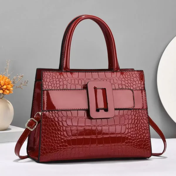 Red crocodile leather handbag with buckle