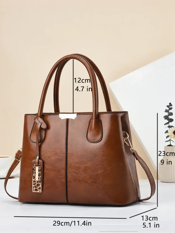 Brown leather handbag with size dimensions.